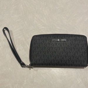 Micheal Kors black and silver wristlet